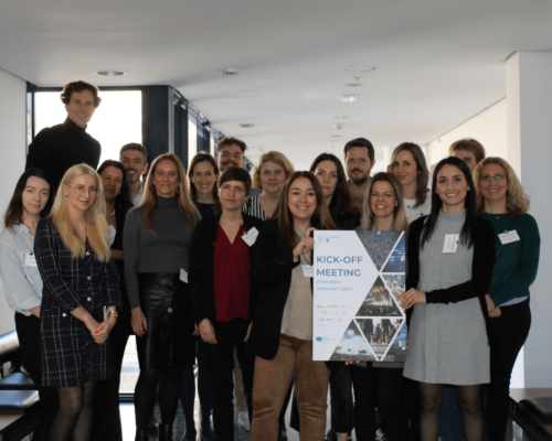 Group of 18 people from the cosecur team holding a sign.