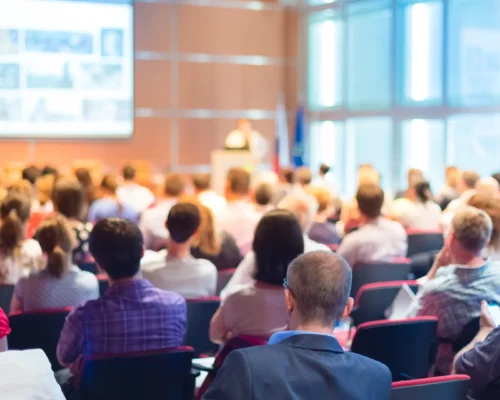 Show the audience confidence at a massive event from a presentation talk